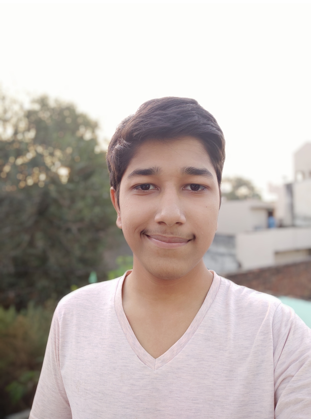 Denosaurabh smiling at front of camera